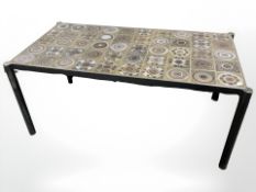 An enameled metal and tile inset coffee table,