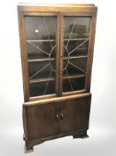 A glazed oak double door display cabinet,