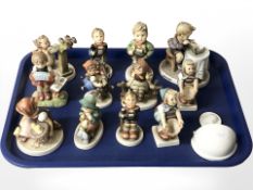 A group of Goebel figures of boys and girls,