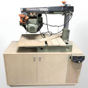 A Dewalt Power Shop circular saw on cabinet fitted with a vice,