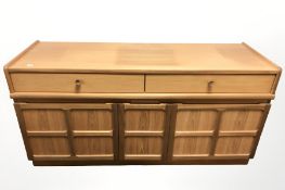 A Nathan teak low sideboard, 130 cm x 47 cm x 65 cm.