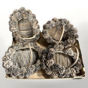 Four rustic pine pinecone baskets.