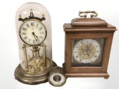 A Kundo brass anniversary clock under dome,