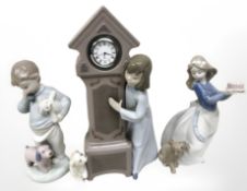 Three Nao figures including Girl with grandfather clock etc tallest 25 cm