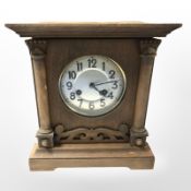 An early 20th century beech eight day mantel clock, height 31 cm.