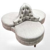 A contemporary Victorian-style three-seater conversation settee, width 135 cm.