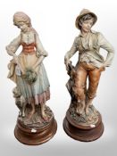A large pair of continental bisque figures of a lady and gentleman, height 62 cm.