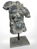 A contemporary sculpture of a torso,
