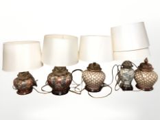 A Japanese earthen ware lamp base, two further pairs all with shades,