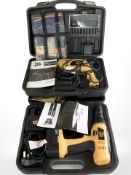 Two boxed JCB power drills with accessories, manuals, etc.