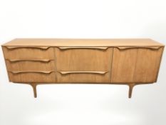A 20th century teak low sideboard, 198 cm L x 45 cm D x 77 cm H.