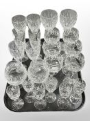 A collection of crystal wine and champagne glasses, two rummers, some pieces by Stuart Crystal.