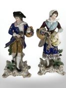A pair of 20th century German porcelain figurines in the style of Meissen,