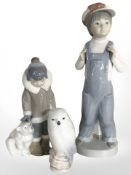 Two Lladro figures comprising boy in dungarees and boy with polar bear,