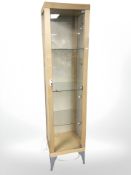 A contemporary square illuminated display cabinet with glass shelves and key, width 45 cm.