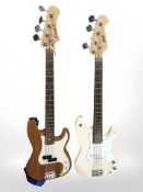 A Westfield electric bass guitar and a Swift electric bass guitar