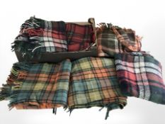 A quantity of tartan blankets.