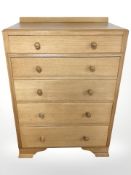 A 20th century oak five drawer chest,