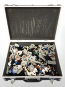 An aluminium case containing LEGO castle building blocks.