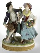 A 20th century German porcelain figure group in the style of Meissen,