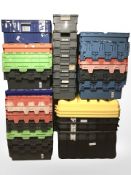 A large quantity of stackable plastic storage containers with lids,