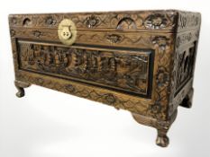 A heavily carved oak camphor wood blanket box,