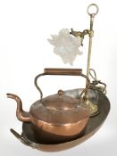 A brass rise and fall table lamp with frosted petal shade,