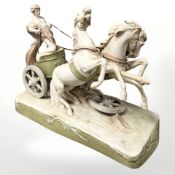 A large Royal Dux figure group of a charioteer and horses,