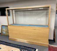 A large contemporary oak veneered and glazed display cabinet, 227 cm x 54 cm x 185 cm.