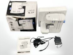 A Dunelm Sew Easy overlocker sewing machine, boxed.