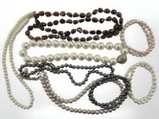 A group of pearls and stained pearl necklaces and bracelets,