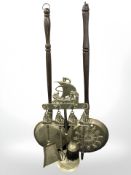 Two Victorian brass bed pans and a fire companion set.