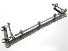 A painted metal fire curb, length 137 cm.