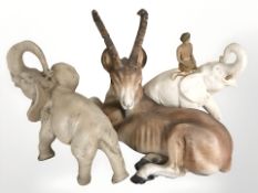 Two resin elephant figures and a further antelope.