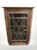 A 19th century glazed oak hanging corner cabinet (as found),