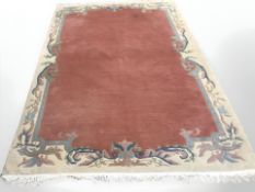 A Chinese carpet on salmon ground,