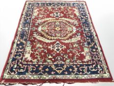 An Eastern woolen rug on red ground,