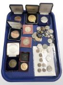 A group of pre decimal coins, medallions, charm bracelet, etc.