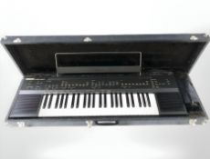 A Yamaha PSR-60 digital keyboard, with pedal, no power lead, in hard storage case.