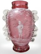 A Victorian Mary Gregory-style twin-handled cranberry glass vase,