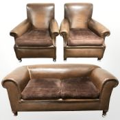 A 1930s faux leather three piece suite comprising club settee, width 160 cm, and pair of armchairs.
