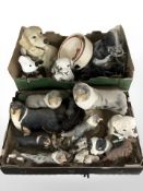A group of resin dog ornaments, dog bowls and leads.