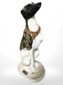 A painted composition figure of a whippet, height 50 cm.