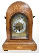 A late Victorian walnut and satinwood inlaid eight day chiming bracket clock with German Junghans