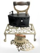 Two brass trivets and two irons.