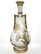 A Royal Worcester circular tapered twin-handled vase painted with flowers on blush ground,