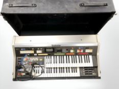 A Technics PCM Sound C 600 electronic organ in flight case with lead