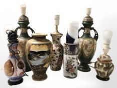 A group of oriental earthenware vases, lamp bases, etc.