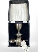 A boxed silver egg cup, napkin ring and spoon Elkington & Co,