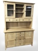 A contemporary oak dresser, 130 cm W x 48 cm D x 190 H.